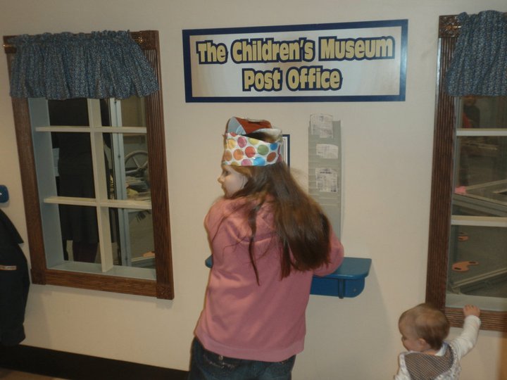 Young Destiny smiling at a museum