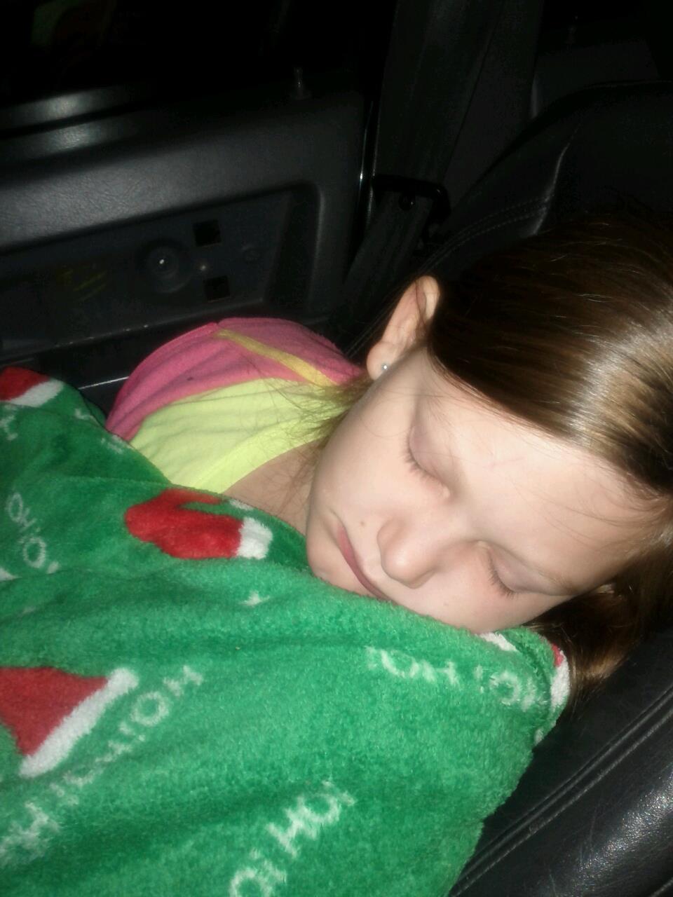 Baby Destiny resting in a green outfit